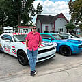 Gary Click is showing off a campaign-wrapped Challenger after racking up 10 traffic citations