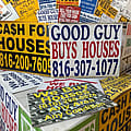 The signs offer quick cash for homes. But states want more oversight.
