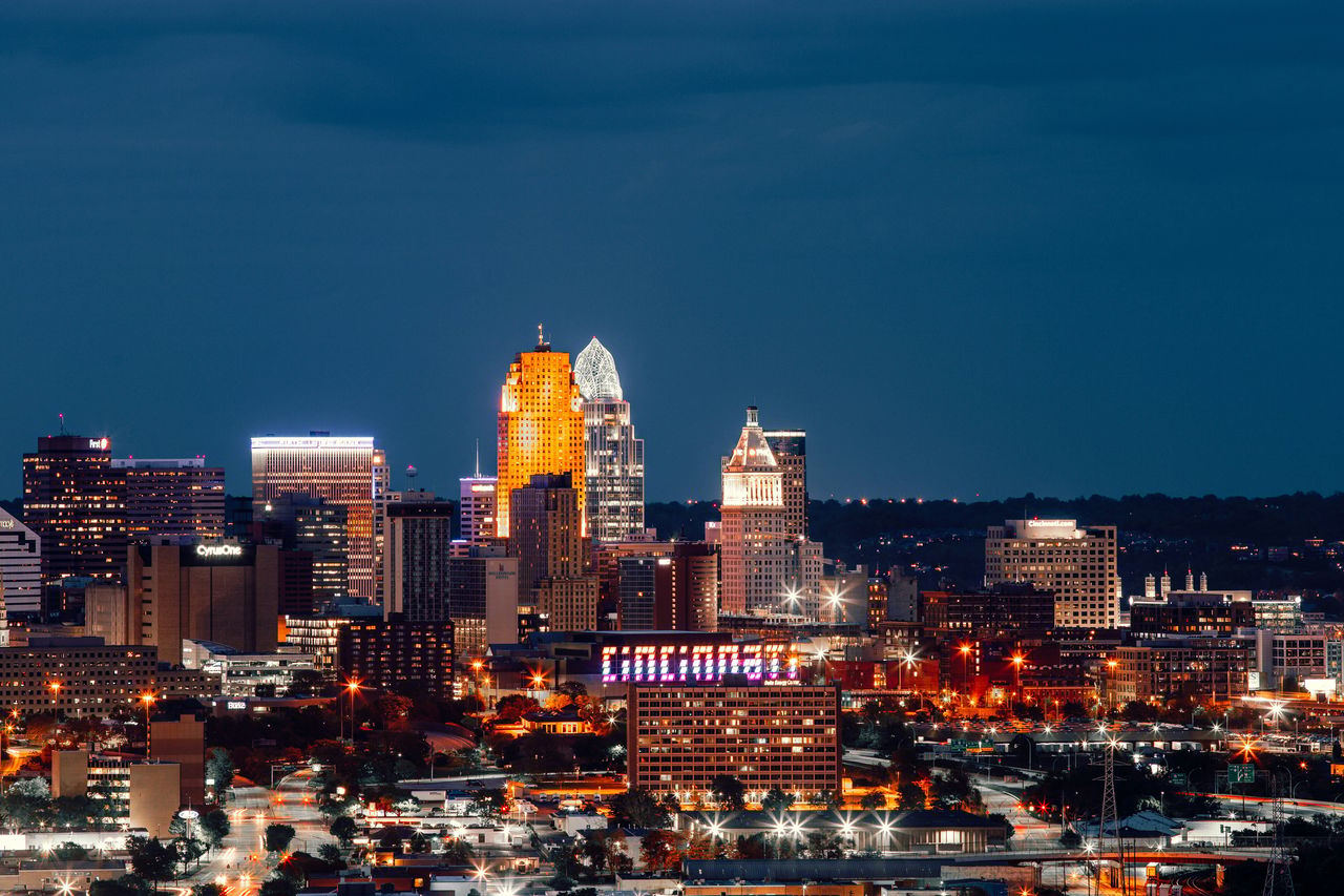 Cincinnati skyline at night, including the Great American Tower and the illuminated Cincinnati sign