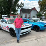Gary Click is showing off a campaign-wrapped Challenger after racking up 10 traffic citations