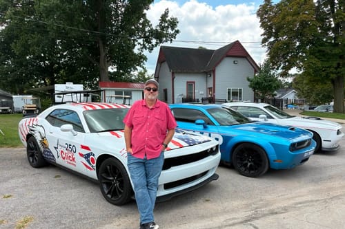 Gary Click is showing off a campaign-wrapped Challenger after racking up 10 traffic citations