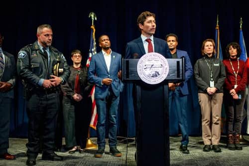 Mayors ignore, flatter or confront Trump to serve their cities
