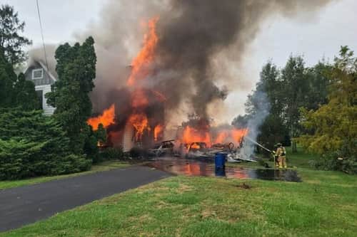 Two hospitalized after car crashes into Seneca County home, igniting fire