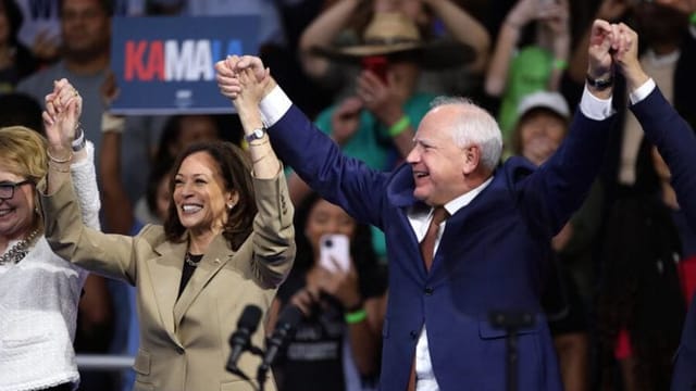 A former high school football coach rises to running mate as Walz accepts VP nomination