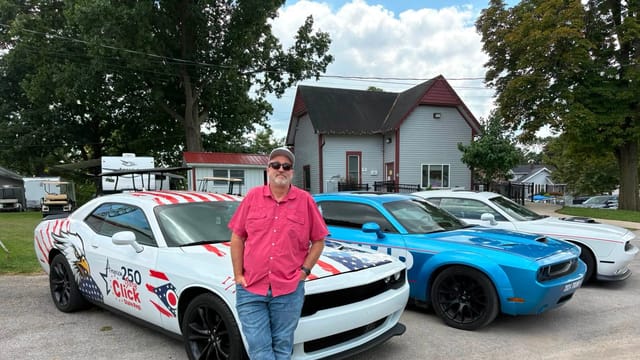 Gary Click is showing off a campaign-wrapped Challenger after racking up 10 traffic citations