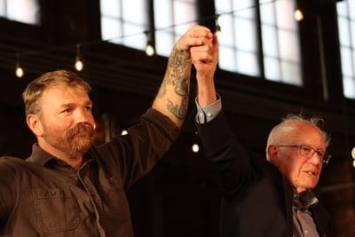 Independent U.S. Sen. Bernie Sanders of Vermont and U.S. Senate candidate Graham Platner rally together in Portland, Maine, on May 25, 2026. (Photo by Emma Davis/ Maine Morning Star)