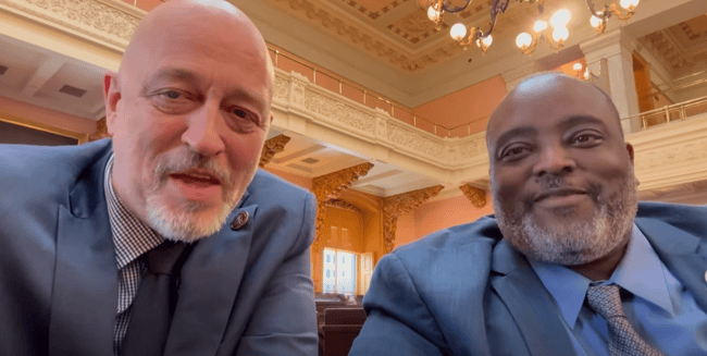 State Rep. Gary Click, R-Vickery, left, poses for a selfie with state Rep. Darnell Brewer, D-Cleveland, during session of the Ohio General Assembly.