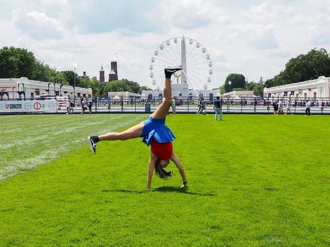 Tanya Geders, 43, of St. Louis, Missouri, modeled a cartwheel for her son on the National Mall at the Freedom 250 Great American State Fair on Thursday, June 25, 2026. (Photo by Ashley Murray/States Newsroom)