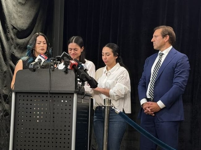 Johan Sebastián Durán Guerrero’s wife, Karolina Rojas Alvarez, spoke at a press conference on July 16, 2026. Her husband was killed by federal immigration agents July 13. She was joined by a translator, left, Guerrero’s sister, right, and attorney Benjamin Gideon. (Photo by Eesha Pendharkar/Maine Morning Star)