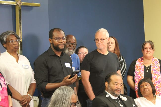 Haitian Support Center Executive Director Viles Dorsainvil (left) and Carl Ruby, pastor of Springfield’s Central Christian Church (right) speaking to the media in Springfield, Ohio.