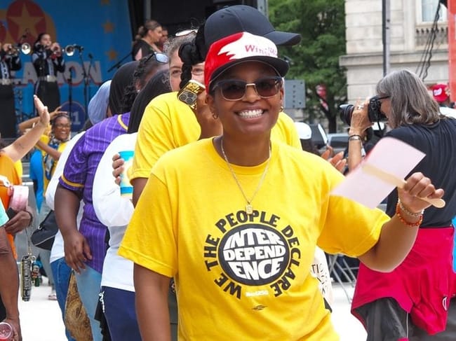 Te’Drenna Coleman, 27, of Charlotte, North Carolina, danced at the Next250 rally in Washington, D.C., on Saturday, June 27, 2026, as the Maryland-based Mariachi Imperio band played. (Photo by Ashley Murray/States Newsroom)
