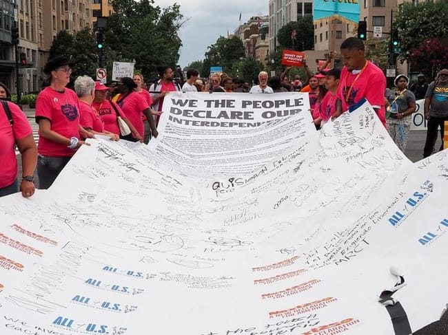 Marchers carried a “Declaration of Interdependence” during a Next250 demonstration in Washington, D.C., on Saturday, June 27, 2026. (Photo by Ashley Murray/States Newsroom)