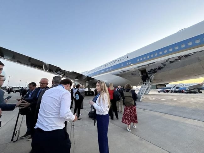 As the press boards the former Air Force One, this photo clearly shows in the background the other aircraft, reported to be the one that Trump covertly flew from Turkey to the United Kingdom. (White House pool photo)