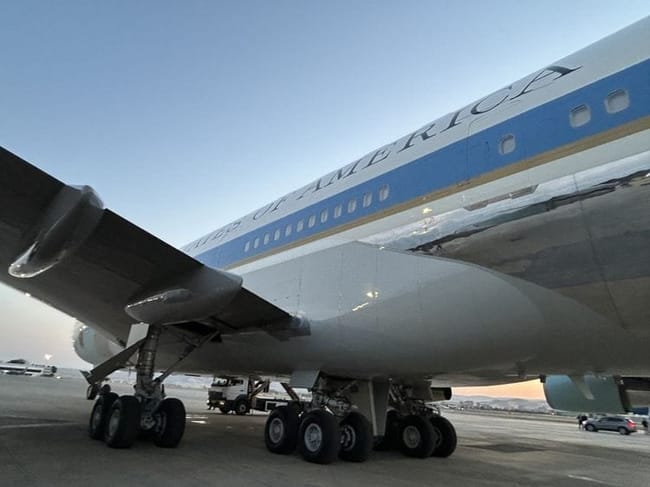 A closer view of the former Air Force One and the catering truck reportedly used to secretly transport President Donald Trump to a military plane in Ankara, Turkey, on July 8, 2026. The truck can be seen to the left, under the plane. (White House pool photo)