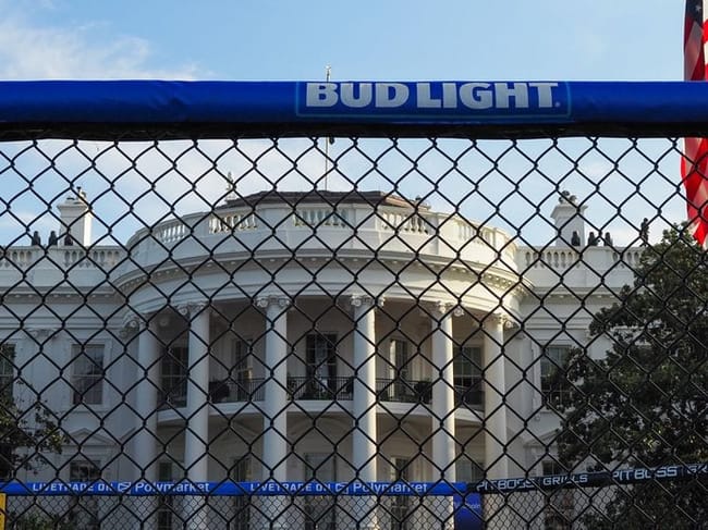 Various advertisements, including those for Bud Light beer and Polymarket live betting, surrounded the Ultimate Fighting Championship ring, or "octagon," on the White House South Lawn on Thursday, June 11, 2026. (Photo by Ashley Murray/States Newsroom)