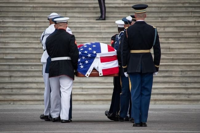 The flag-draped casket of the late Sen. Lindsey Graham, R-S.C., is carried into the U.S. Capitol on July 28, 2026. (Photo by Sam Gauntt/States Newsroom)