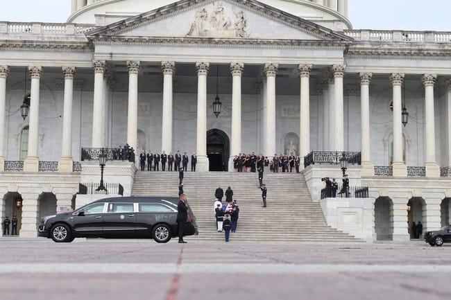 The flag-draped casket of the late Sen. Lindsey Graham, R-S.C., is carried into the U.S. Capitol on July 28, 2026. (Photo by Sam Gauntt/States Newsroom)