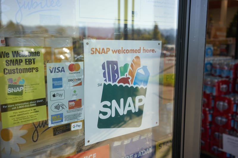 A SNAP sign in a store window. (Photo: iStock)