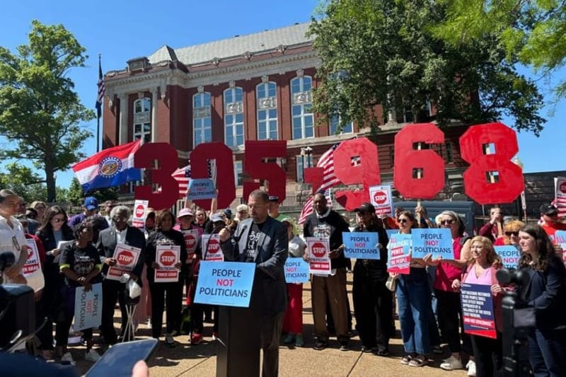Demonstrators rallied outside the Missouri Supreme Court on Tuesday, May 12, 2026, as judges weigh challenges to a GOP-supported congressional map. The number 305,968 references the number of signatures of voters seeking to force a statewide referendum vote on the lines (Photo by Jonathan Shorman/States Newsroom)