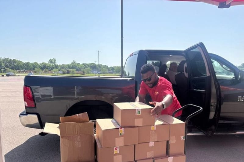 Children’s Hunger Alliance distributes boxes with ready-to-eat meals at Tecumseh High School in New Carlisle on Wednesdays during the summer. (Photo by Megan Henry, Ohio Capital Journal.)