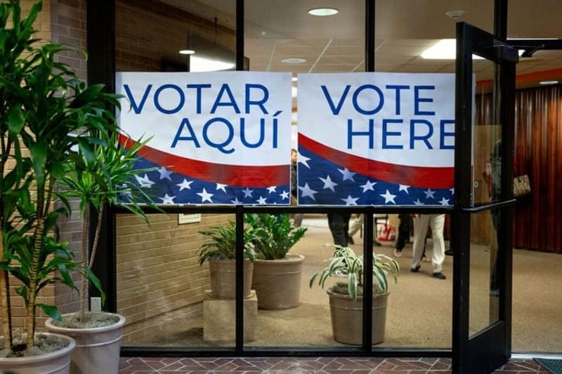 Signs in English and Spanish direct voters to the polls at the Salt Lake County Government Center in Salt Lake City on Tuesday, Nov. 5, 2024. (Photo by Spenser Heaps for Utah News Dispatch)