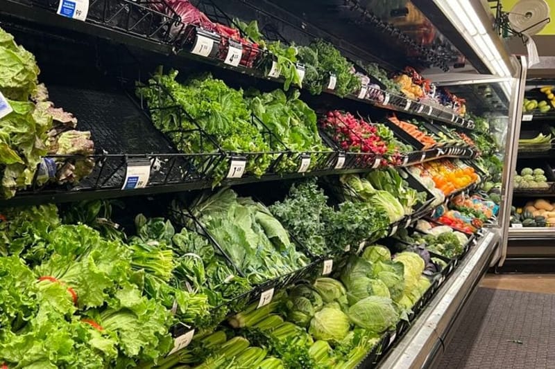 Vegetables and lettuces at a grocery store in Michigan. Michigan health officials say lettuces and salad greens are emerging as a likely source in the nationwide cyclosporiasis outbreak, which has sickened hundreds of people across 31 states. (Photo by Jon King/Michigan Advance)