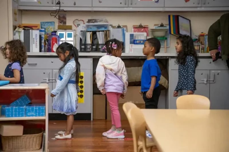Preschool children line up to go outside at the Ralph Hawley Head Start Center in Emeryville, Calif., in December. (Photo by Florence Middleton for CalMatters)