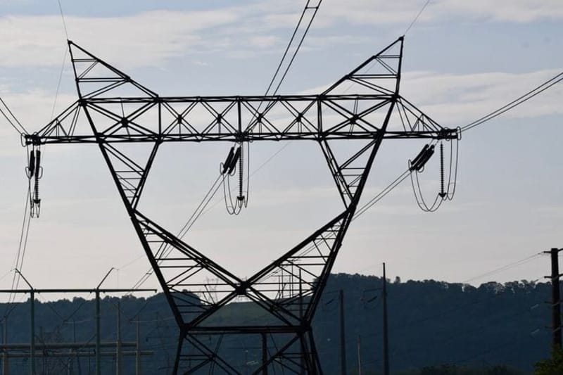Power lines cross the Susquehanna River near the Hummel Station power plant in Snyder County, Pennsylvania. (Photo by Peter Hall/Capital-Star)