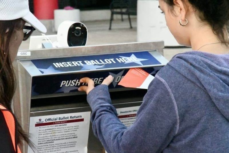A voter deposits a mail-in ballot at the drop box outside the Chester County Government Center on Tuesday, Nov. 5, 2024. (Photo by Peter Hall/Pennsylvania Capital-Star)