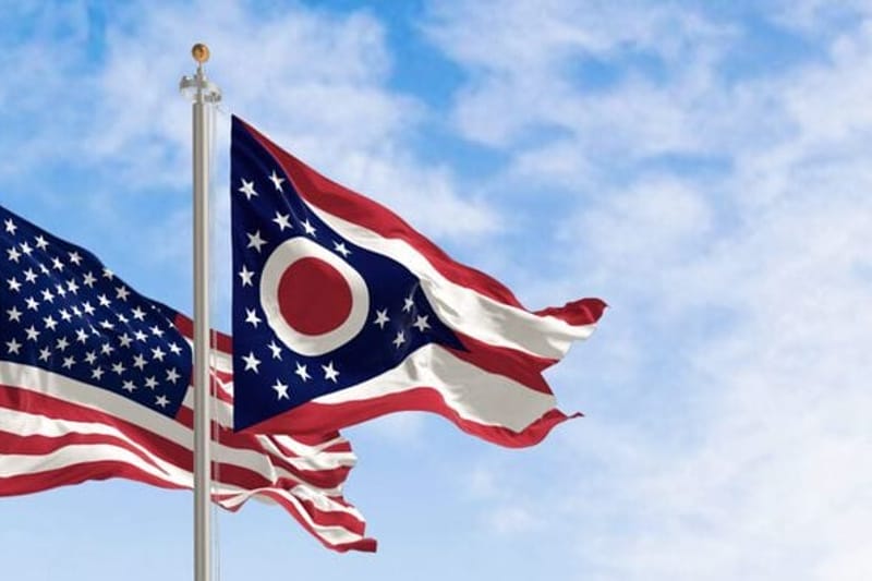 The Ohio burgee waving along with the national flag of the United States of America. (Stock photo from Getty Images.)