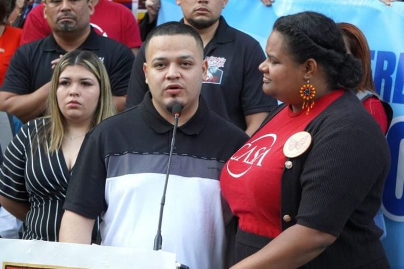 Kilmar Abrego Garcia speaks to people who held a prayer vigil and rally on his behalf outside the Immigration and Customs Enforcement building in Baltimore, Maryland, on Aug. 25, 2025. Lydia Walther Rodriguez with CASA interprets for him. (Photo by William J. Ford/Maryland Matters)