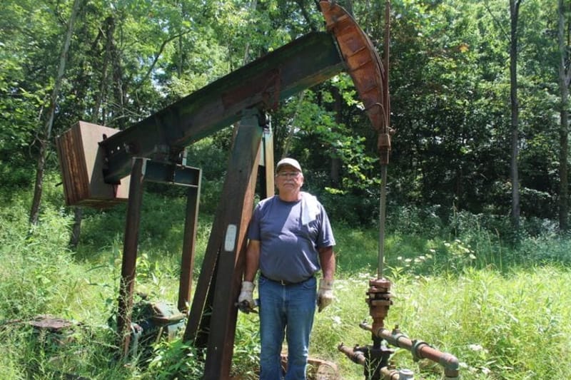 Bob Wilson, an oil producer in Washington County stands in front of one of his injection wells. (Photo by Megan Henry, Ohio Capital Journal).