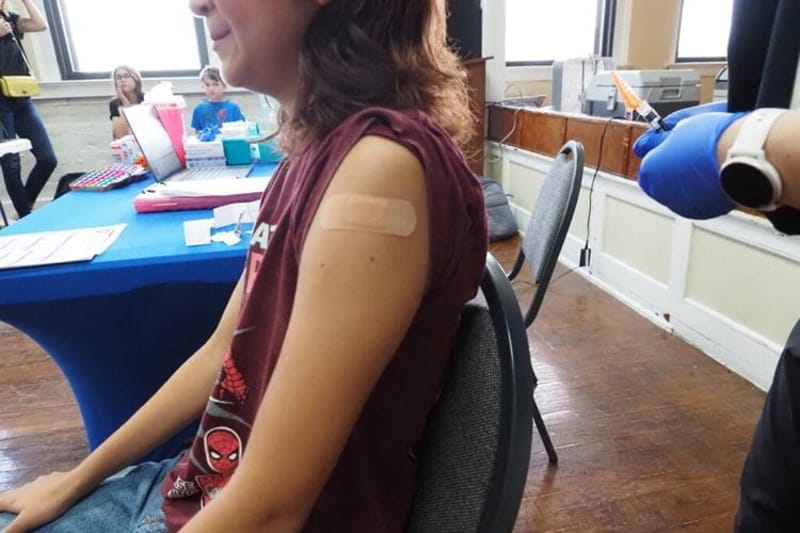 A nurse vaccinates a child at the Latino Community Development Agency on July 9, 2026, in Oklahoma City. As vaccination rates decline nationwide, measles cases have surpassed 2025 to the highest since the disease was declared eliminated in the U.S. in 2000. (Photo by Courtney Bell/Oklahoma Voice)