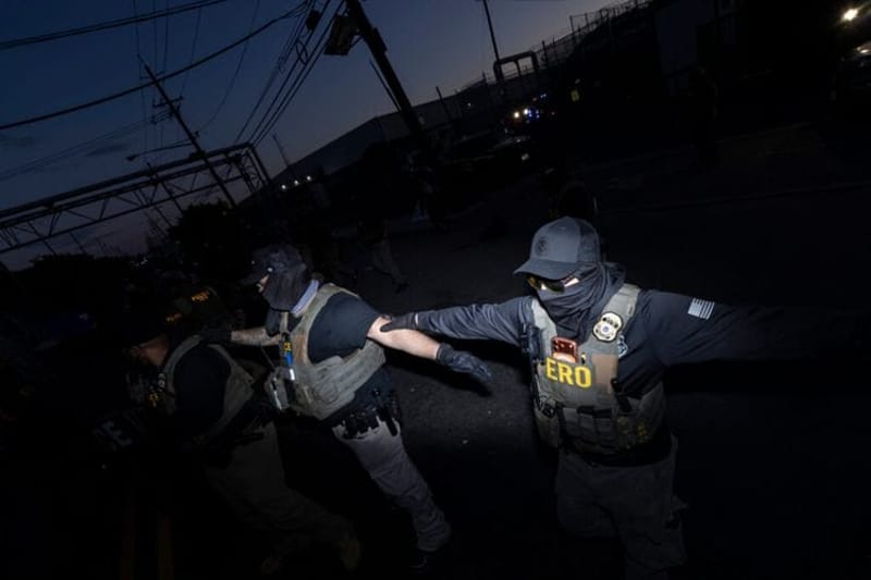 ICE agents link arms outside Delaney Hall in Newark, N.J., on May 28, 2026. An ongoing hunger and labor strike at the 1,000-bed migrant detention facility reportedly involves roughly 300 people and has sparked daily protests outside. (Photo by Anne-Marie Caruso/New Jersey Monitor)