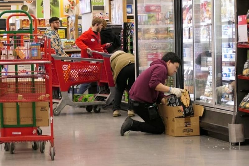 Employees stock groceries at a Target store in Minnesota. More than 20 states and cities, including St. Paul, Minn., are increasing minimum wages next month. (Photo by Max Nesterak/Minnesota Reformer)