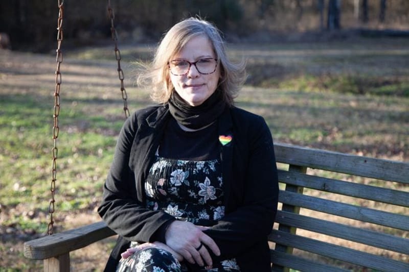 Mylissa McNeill, sitting outside her home in Jacksonville, Ark., earlier this year, says she was denied prompt miscarriage care in August 2022. It was the beginning of a cascade of health problems that she blames, at least in part, on hospitals’ reluctance to provide miscarriage management care that might run afoul of state abortion bans. (Photo by Katie Adkins/Arkansas Advocate)