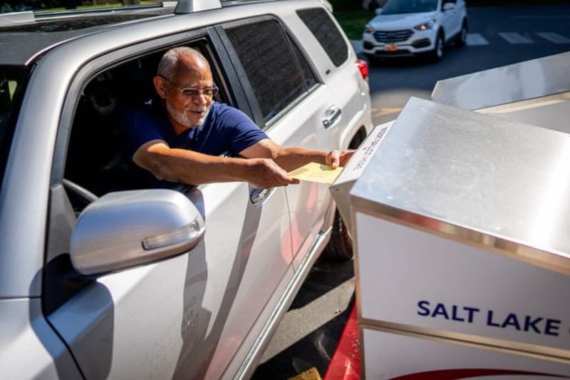 A voter drops off his ballot at the Salt Lake County Government Center in Salt Lake City as votes are cast in Utah’s 2024 primary election. Utah and at least eight other states enacted voting laws this year that will make it more difficult for some voters to cast their ballots during the midterm elections in November. (Photo by Spenser Heaps for Utah News Dispatch)