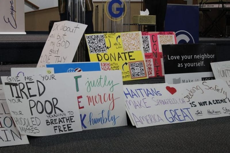 Signs of support for Haitians in Springfield after temporary protected status for Haitians ended on July 27. (Photo by Megan Henry, Ohio Capital Journal).