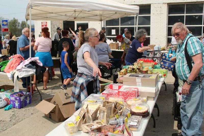 Workers directing people through Faith Fellowship's food pantry. (Photo by Nick Evans, Ohio Capital Journal.)