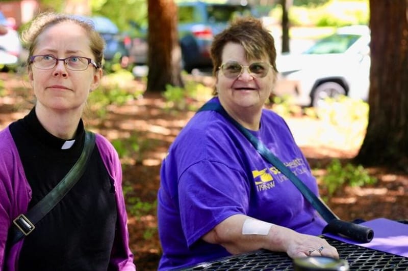 April Frazier, left, and Milli Palmer sit together before speaking last month at a meeting of the Washington State Investment Board, in Olympia, Washington, about their experiences at Providence at Home with Compassus, a home health and hospice company. (Photo by Saiyare Refaei)