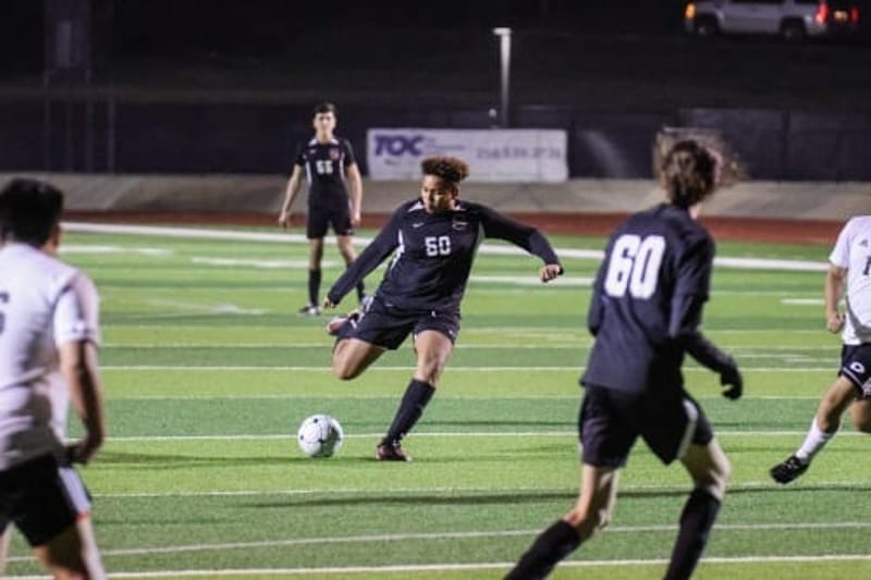 David Faulk played soccer for his high school, shown here, as well as for club teams before transitioning to football. His family paid thousands each year for his sports, a cost that approached $20,000 during his final years of high school. The money that families pour into youth sports has made it increasingly attractive to private investors, including private equity firms. (Photo courtesy of Tiffany Whitlow)