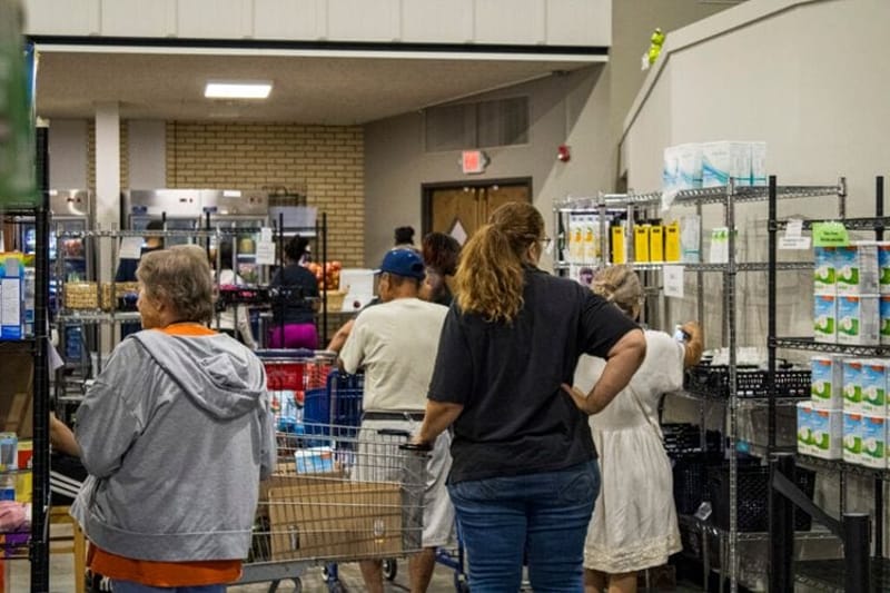 People shop the shelves at the Ritenour Co-Care Food Pantry just outside of St. Louis last week. The nonprofit has seen rising need as grocery prices soar and thousands of Missourians lose federal food assistance. (Photo courtesy of Ritenour Co-Care Food Pantry)