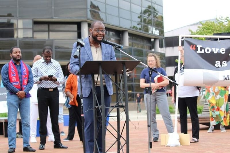 Viles Dorsainvil speaks at a rally in Springfield, Ohio on June 25, 2026. He came to the United States from Haiti in 2020 and is the executive director of the Haitian Support Center in Springfield. (Photo by Megan Henry, Ohio Capital Journal).