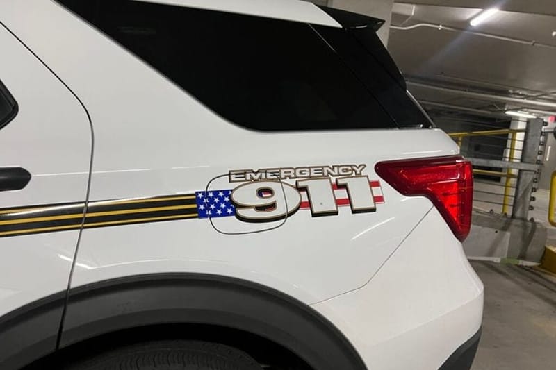 A 911 decal on a Montgomery County, Md., Police Department cruiser. Maryland is among the states that have adopted new laws aimed at supporting first responders’ mental health. (Photo by Amanda Watford/Stateline)