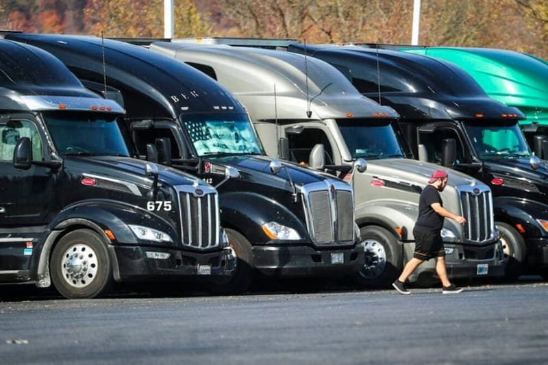 Tractor trailers sit parked in a row at a truck stop in Bloomsbury, N.J. (Photo by Dana DiFilippo/New Jersey Monitor)