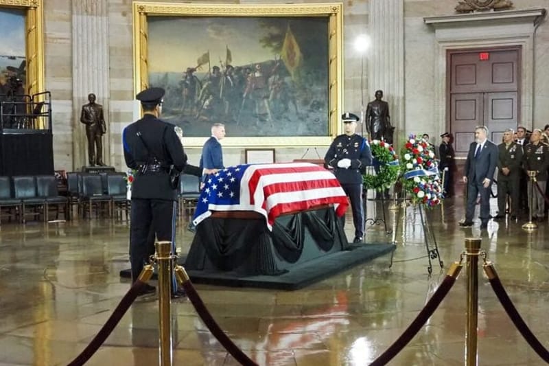 Family, staff and current and former lawmakers, including former House Speaker Kevin McCarthy, in background, filed past the flag-draped casket of the late Sen. Lindsey Graham, R-S.C., at the congressional tribute in the U.S. Capitol Rotunda on Tuesday, July 28, 2026. (Photo by Ashley Murray/States Newsroom)
