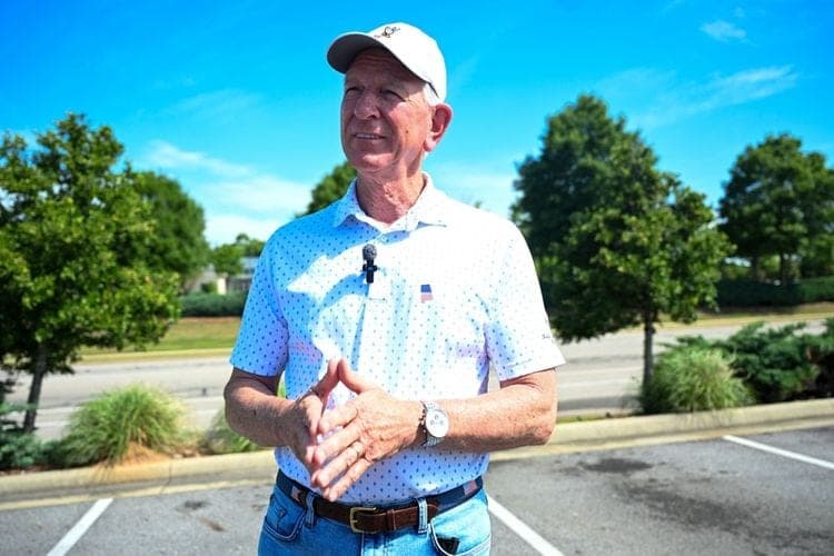 U.S. Sen. Tommy Tuberville, R-Ala., speaks to reporters after voting in the GOP primary in Auburn, Alabama on May 19, 2026. (Photo by Anna Barrett/Alabama Reflector)